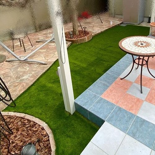 outdoor space after artificial grass installation