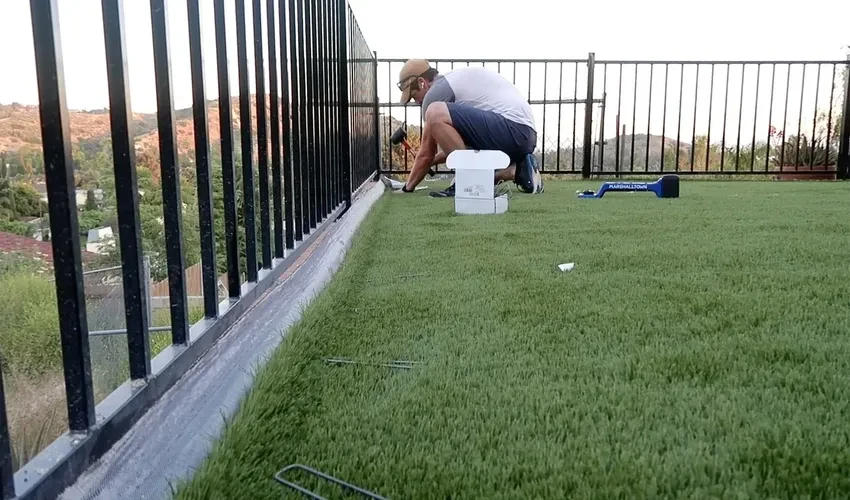 installation of artificial grass on soil